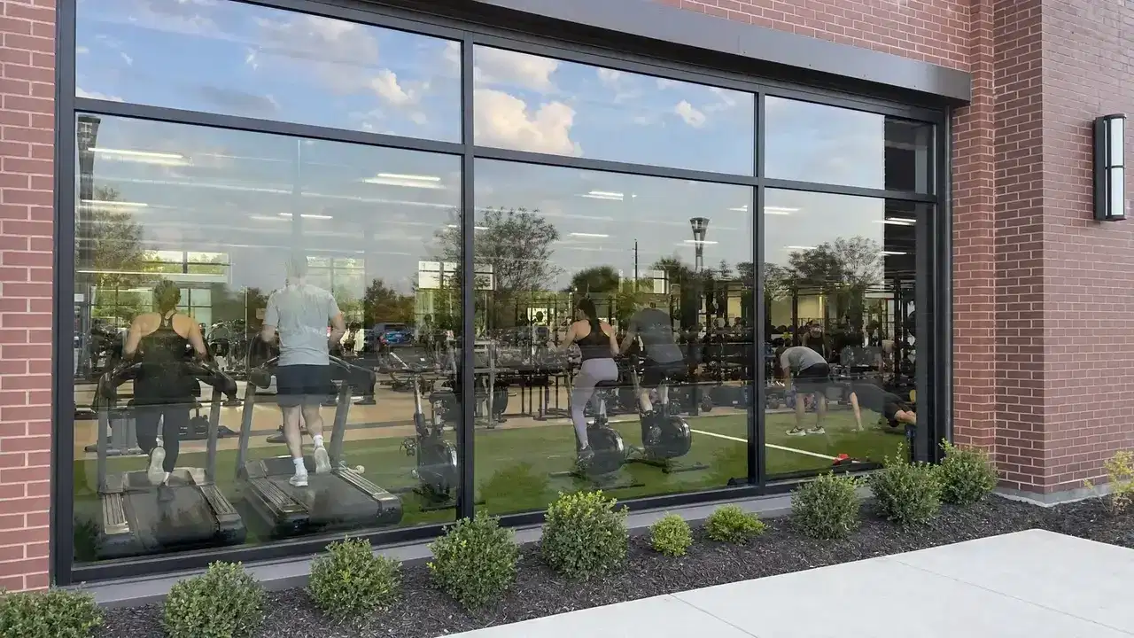 Commercial gym storefront with reflective architectural window film